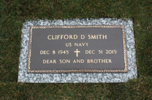 Government bronze marker on granite base with branch of service and title